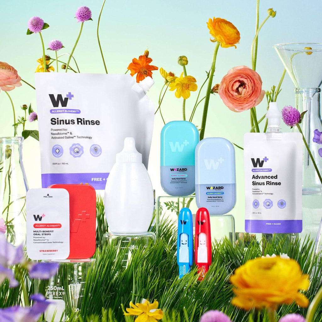 Wizard Wellness products with flowers and grass in the background