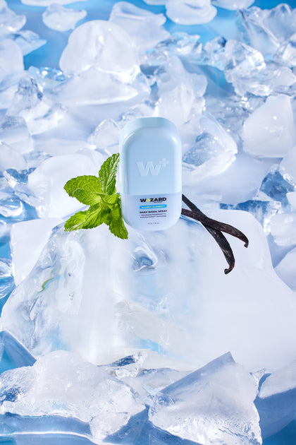 Wizard Nasal Spray bottle with mint and vanilla on ice cubes
