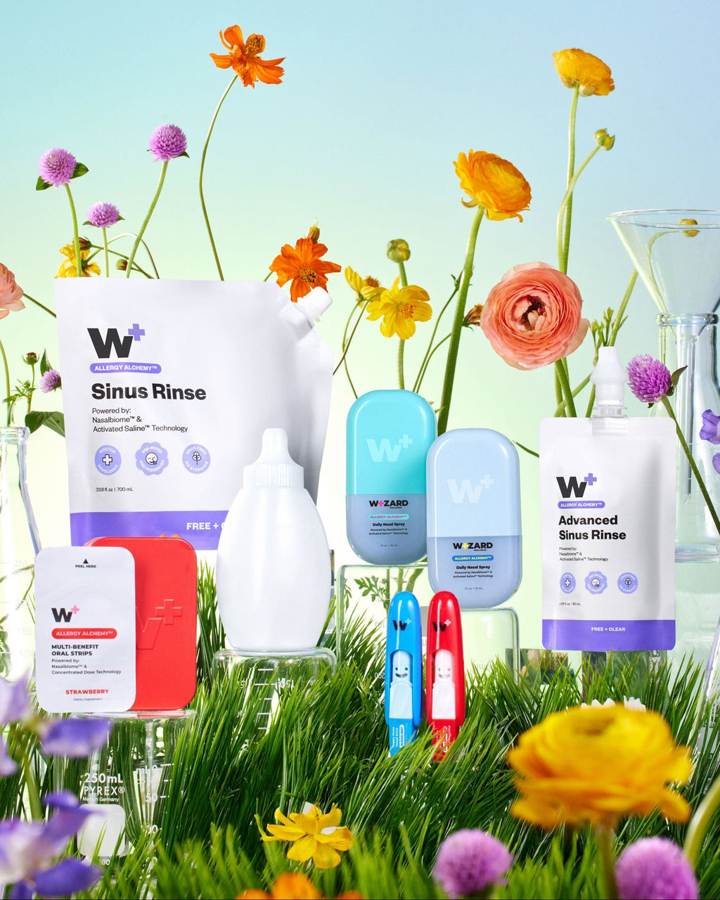Wizard Wellness products with flowers and grass in the background