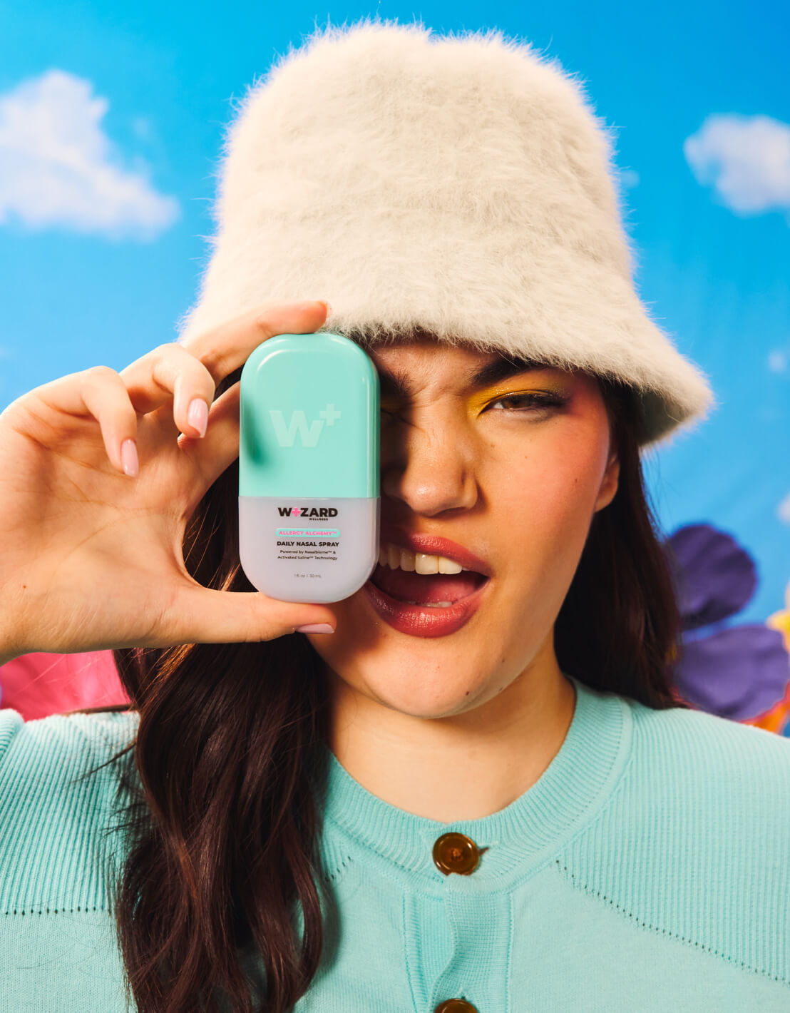 Woman holding the Wizard daily nasal spray