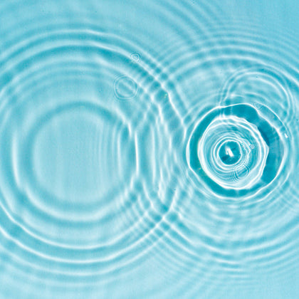 Close-up of water ripples on a blue background